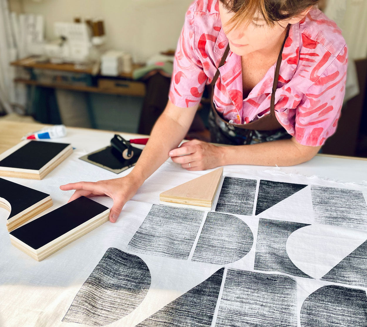 Meg working on a block print fabric design.